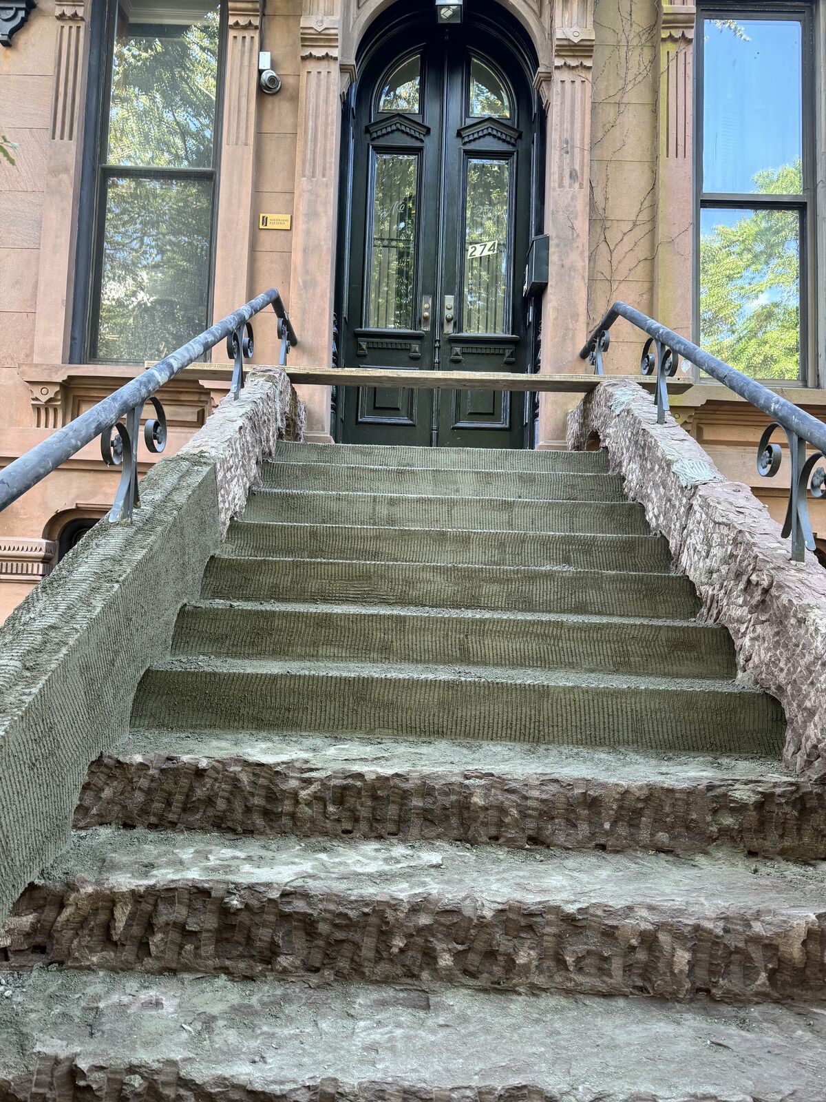 Before: spalled treads with substrate exposed