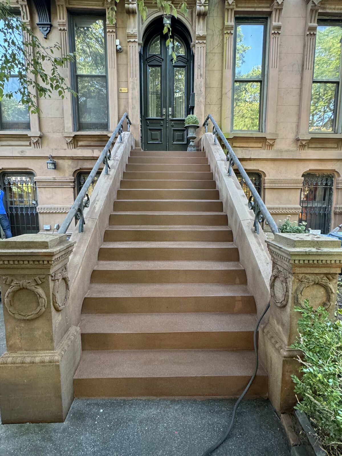Restored stoop against original facade detail