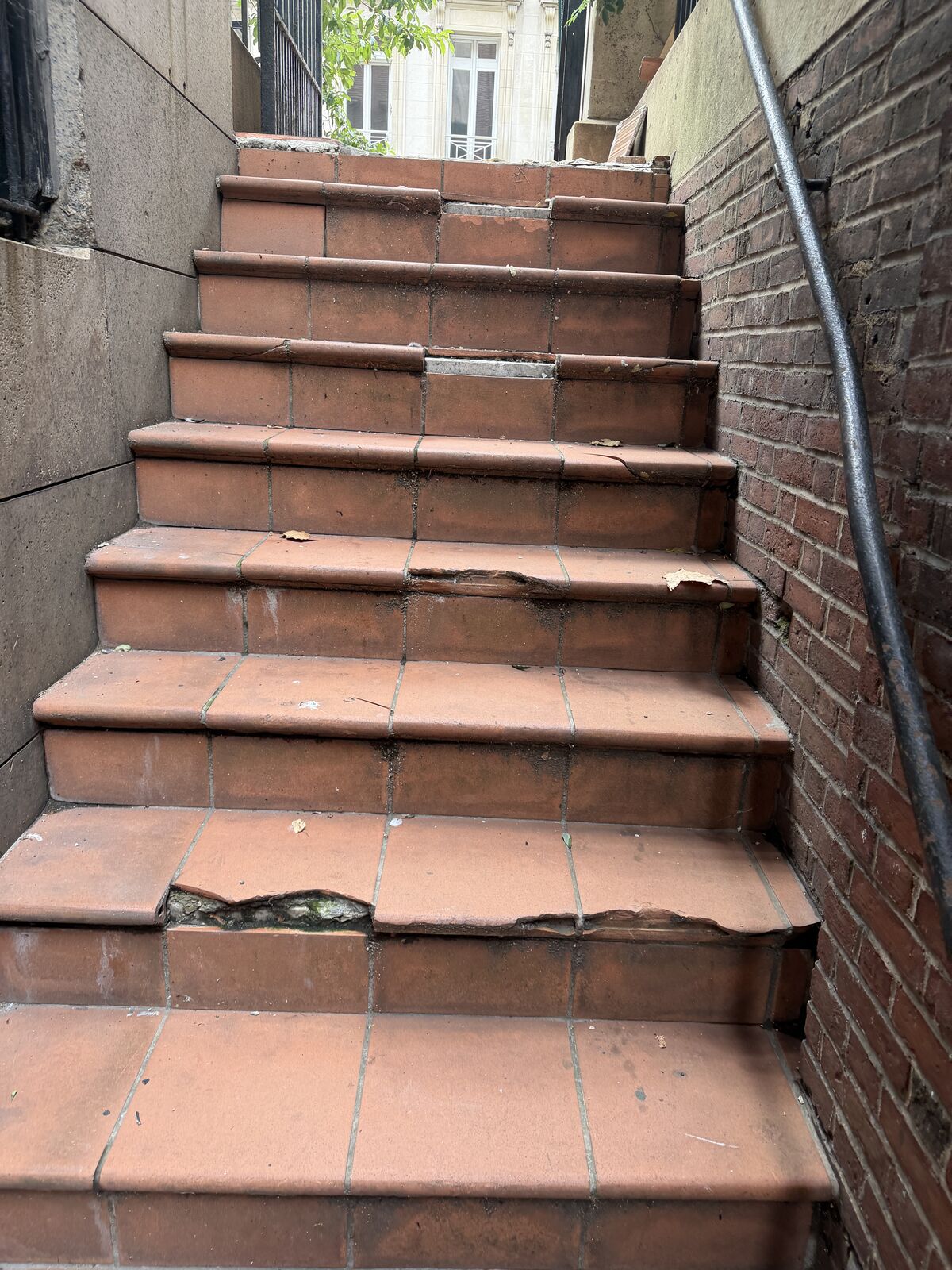 Before: terracotta treads broken back to substrate